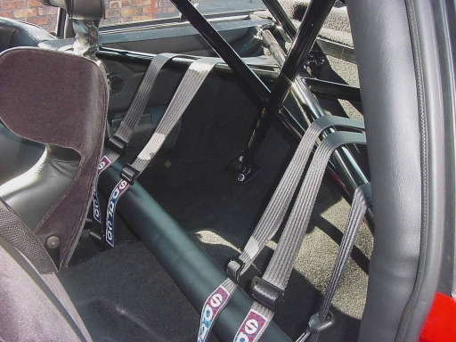 For road use the half cage is better no cage