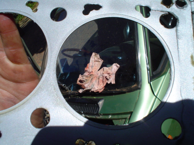 Here can be seen how well the clamping is between the head and sleeve..This is the copper gasket ,sprayed with ally paint..