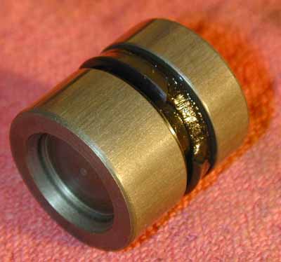 Clutch slave piston with blown gasket